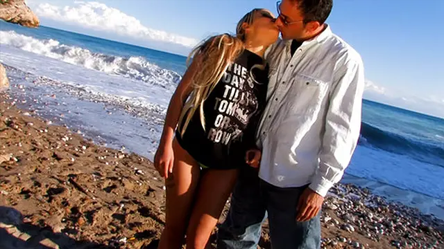 Blond lover fisting her hard at the beach